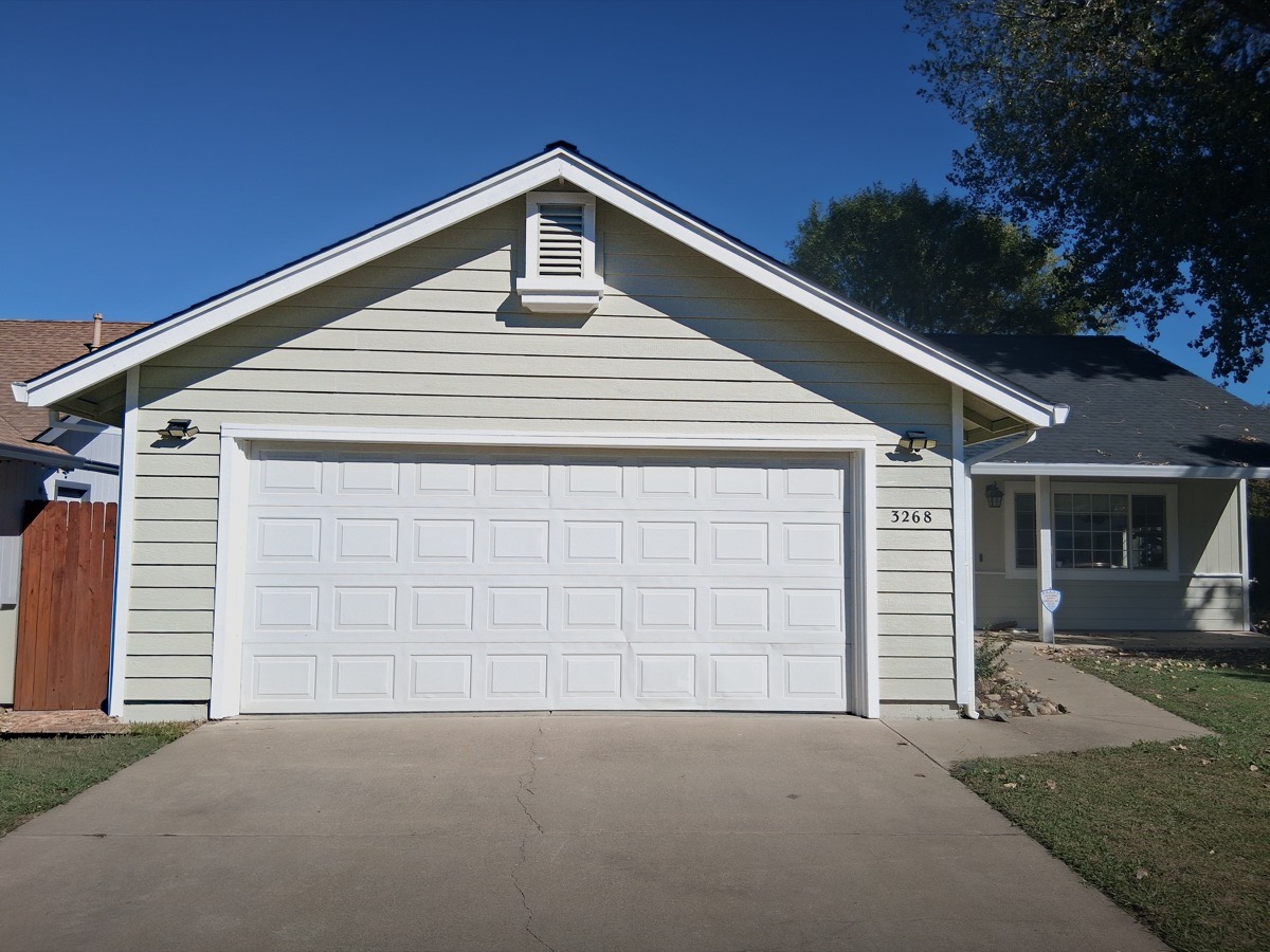 Tan house fresh exterior paint job by Husky Pro Painting